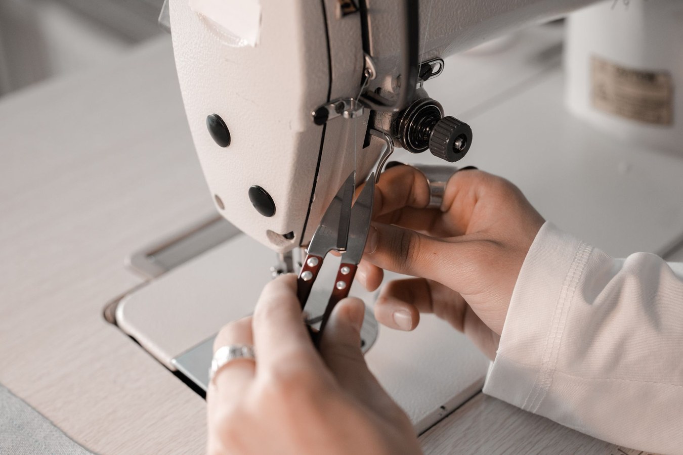Craftspeople at work in Spinwinera workshop with pattern templates and foam shaping